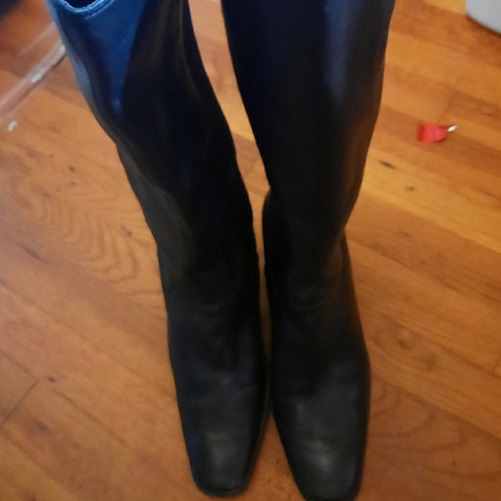 Knee high snug fitting black boots